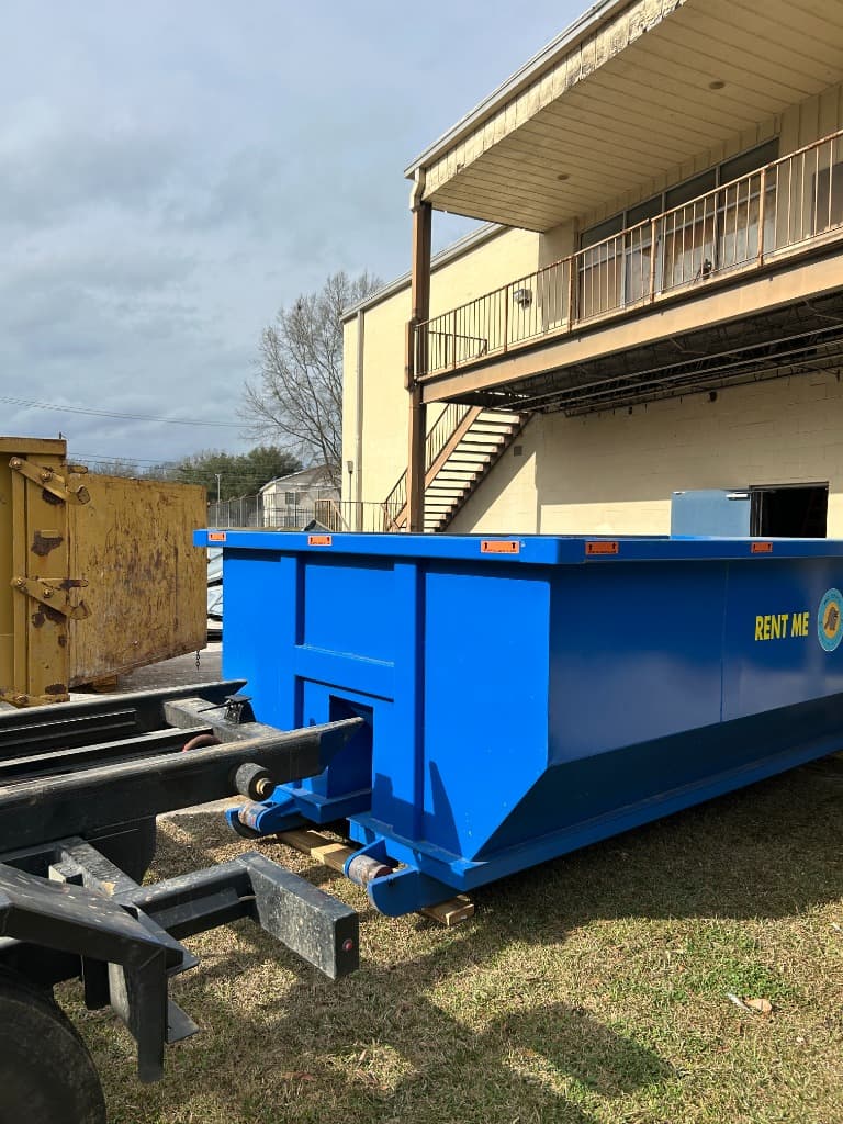 Mid South Dumpster Rentals 15-yard roll-off container in a residential neighborhood in Clinton, Mississippi (Hinds County) — near Olde Towne & Mississippi College